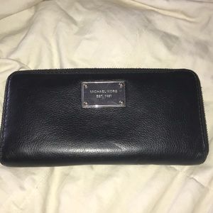 Black Michael Kors Wallet with silver jewelry